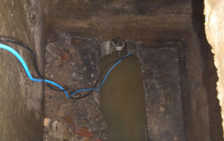 Cables in pipe, dirty water