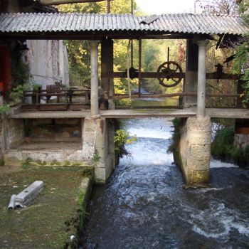 Flowing water underneath a mill